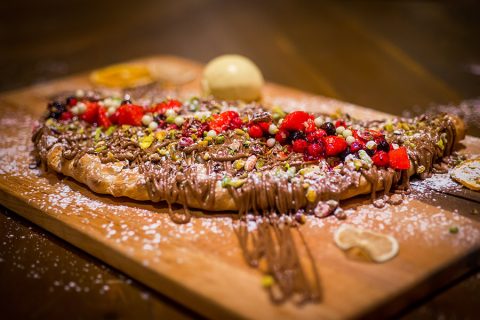 Crepes with nutella, nuts and berries 